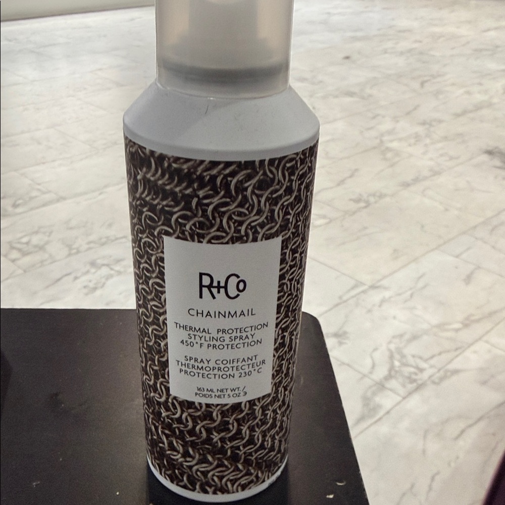 R+Co Chainmail Thermal Styling Spray - Black & White Bottle
